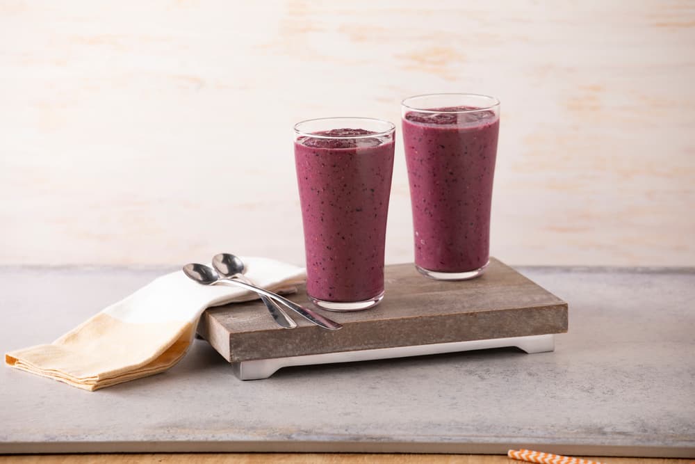 Two glasses of dairy-free berry chocolate smoothie