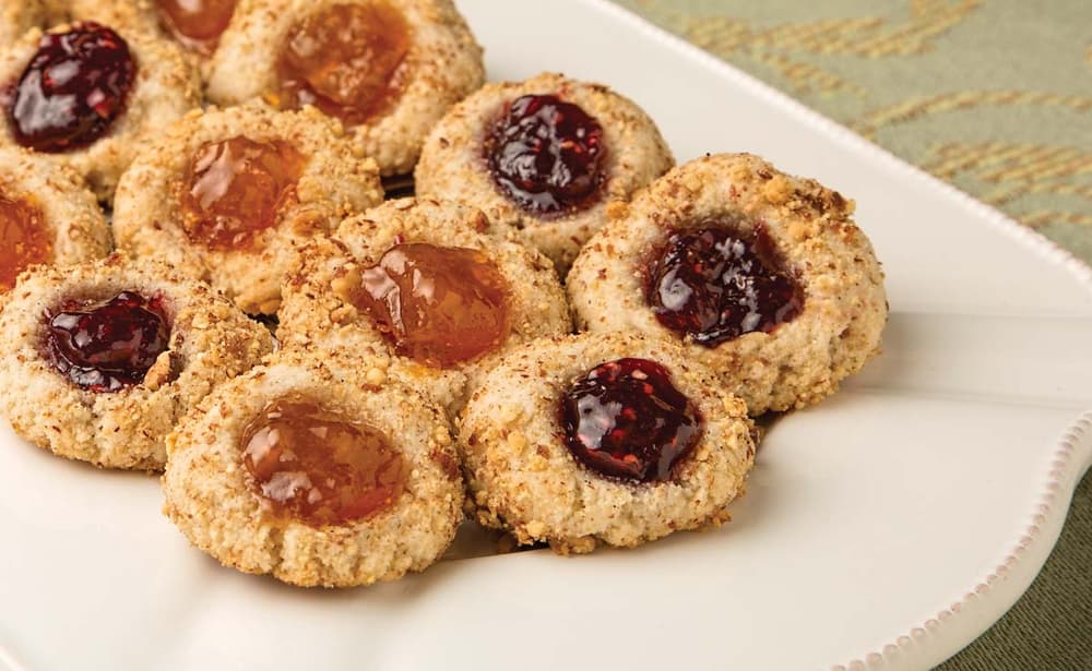 Platter full of gluten-free almond thumbprint cookies made with Blue Diamond Almond Flour