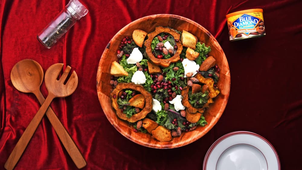 Bowl full of harvest squash salad topped with Blue Diamond Honey Roasted Almonds